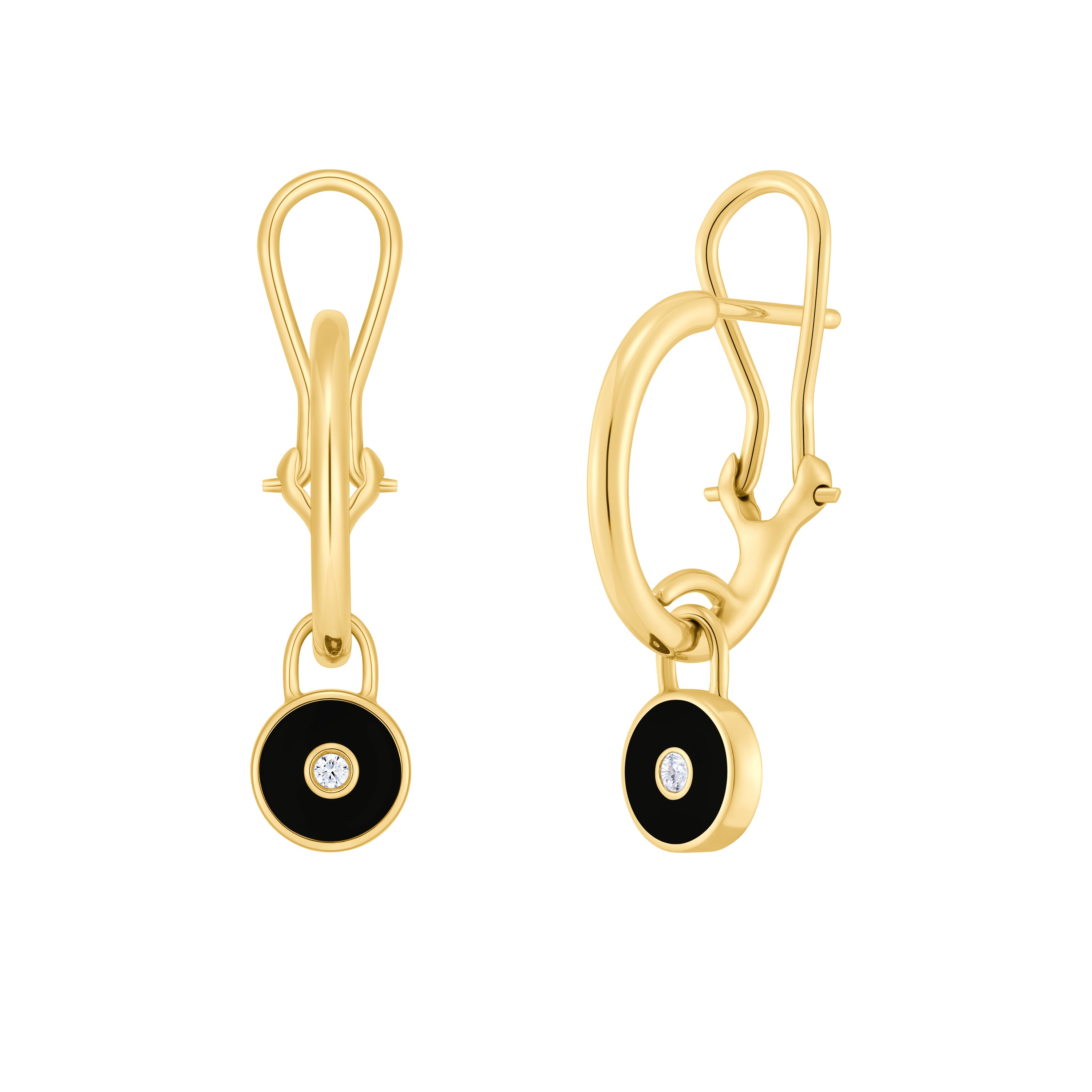 Gold earrings with black stones and clear gemstones on a white background