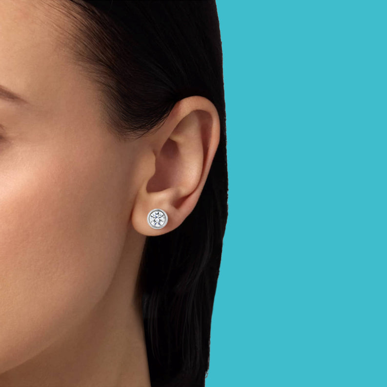 Petite Frites On the Rocks earrings in white gold with diamonds shown on a close up image on model