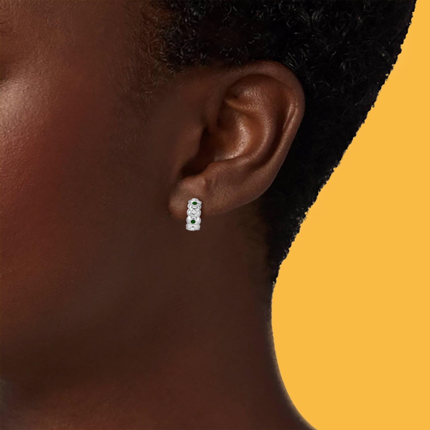 Petite Frites dinner mint earrings in white gold with diamonds and hunter green enamel shown on a close up image of model