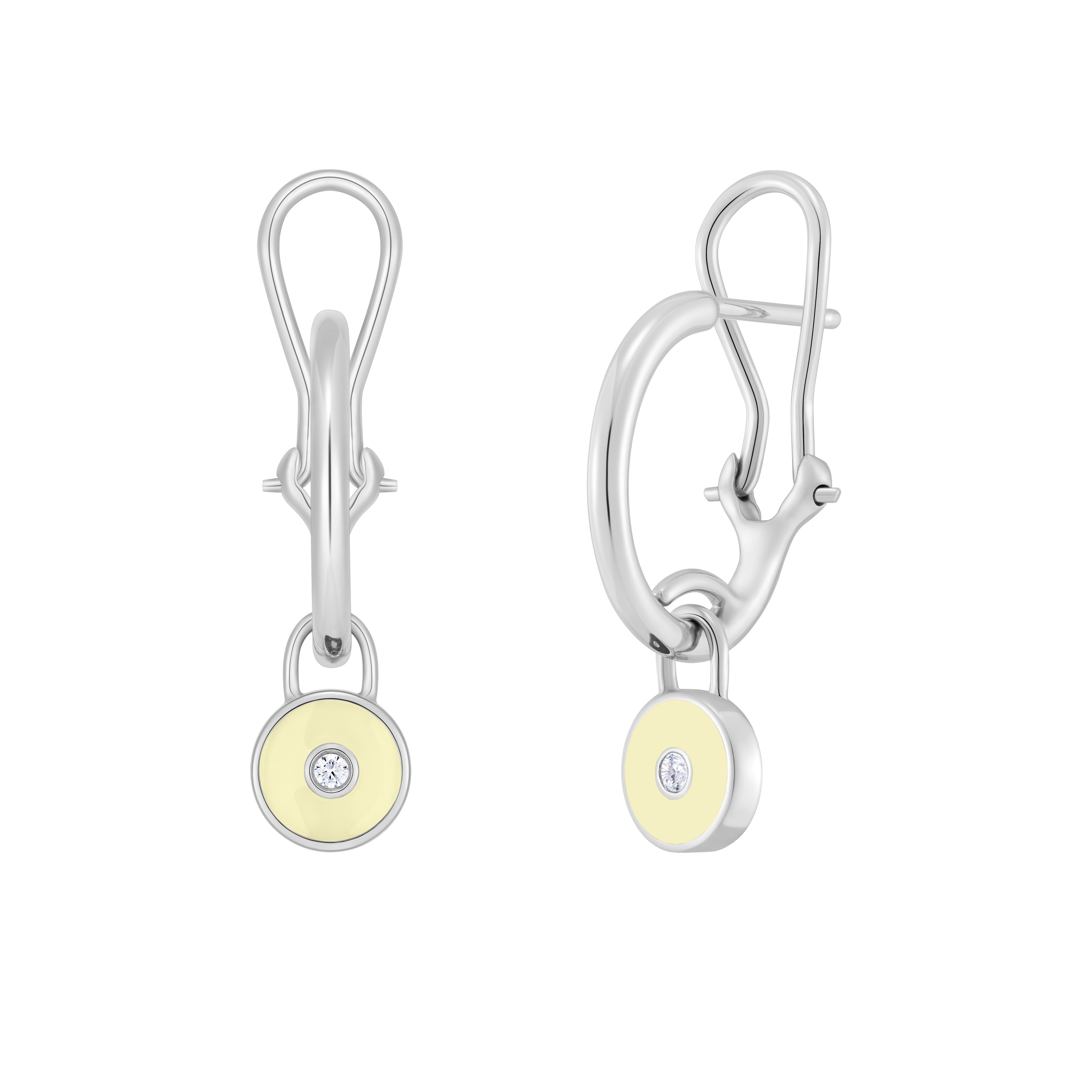White gold earrings with yellow circular stones and clear gemstones on a white background